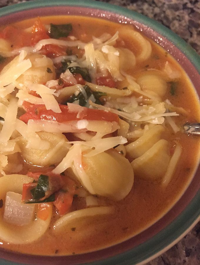 Orecchiette soup with spinach and pancetta.