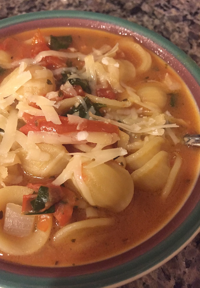 Orecchiette soup with spinach and pancetta.