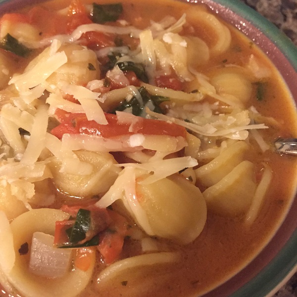 Orecchiette soup with spinach and pancetta.