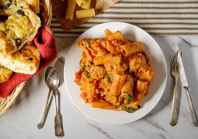 Rigatoni with a creamy vodka sauce with sausage and spinach.