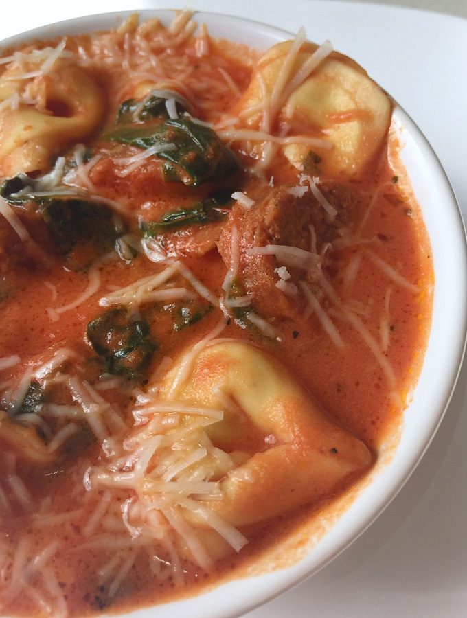 Creamy tortellini soup with sausage and spinach.