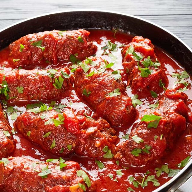 Beef braciole in marinara sauce.