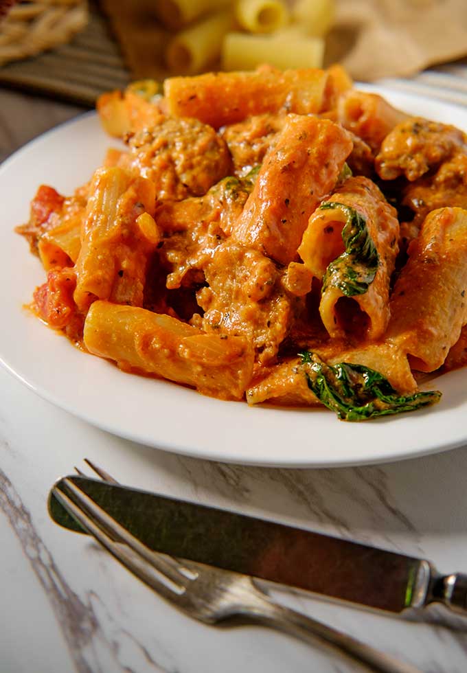 Rigatoni with a creamy vodka sauce with sausage and spinach.